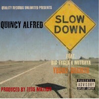 a sign with the words slow down quincy alfred